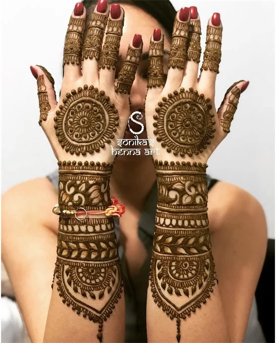 Peacock Inspired Curvy Simple Full Hand Mehndi Design
